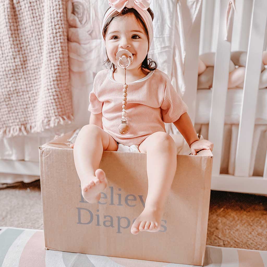 Baby on a Believe Diapers box