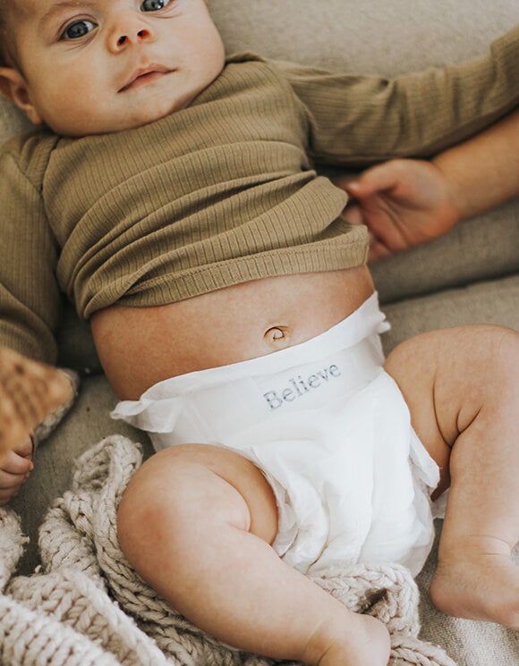 Baby wearing Eco Friendly Believe Diaper